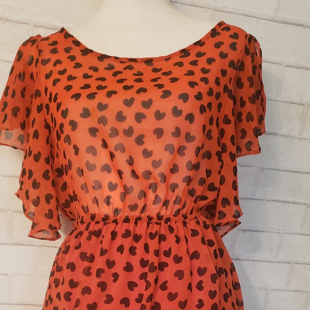 I.ner blacka hearts on red chiffon dress